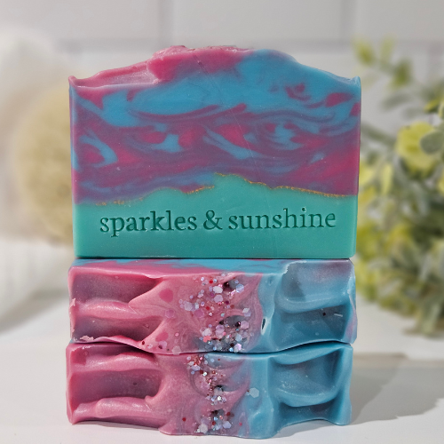 Picture of three bars of soap in shades of blue, green, and pink